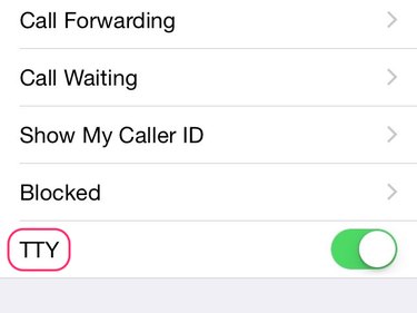 Slide the TTY button to the left to turn it off.