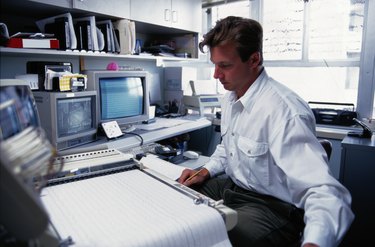 Man Looking at Printout