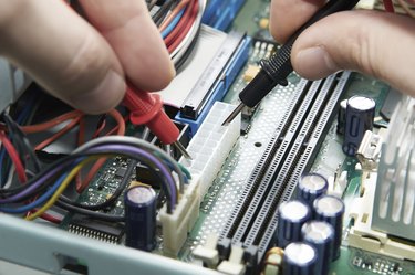 Close-up of a technician hands with voltmeter