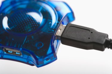 Studio close-up of usb quad port hub and jack
