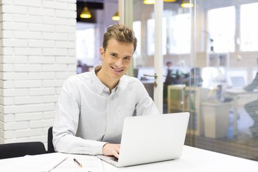 Man working on his laptop at the office in startup