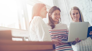 Women researching project plan